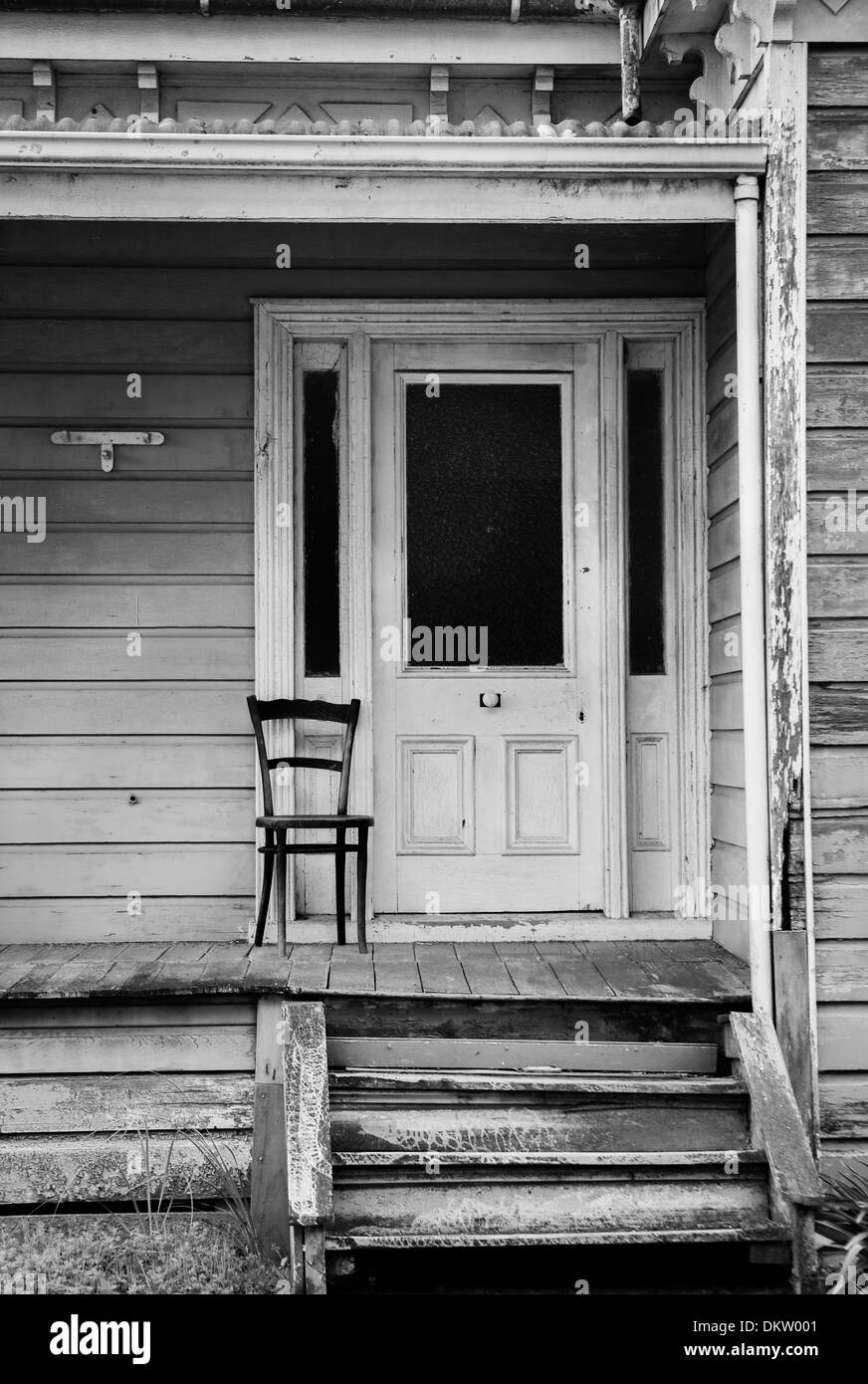 Wooden chair sitting on a porch Stock Photo