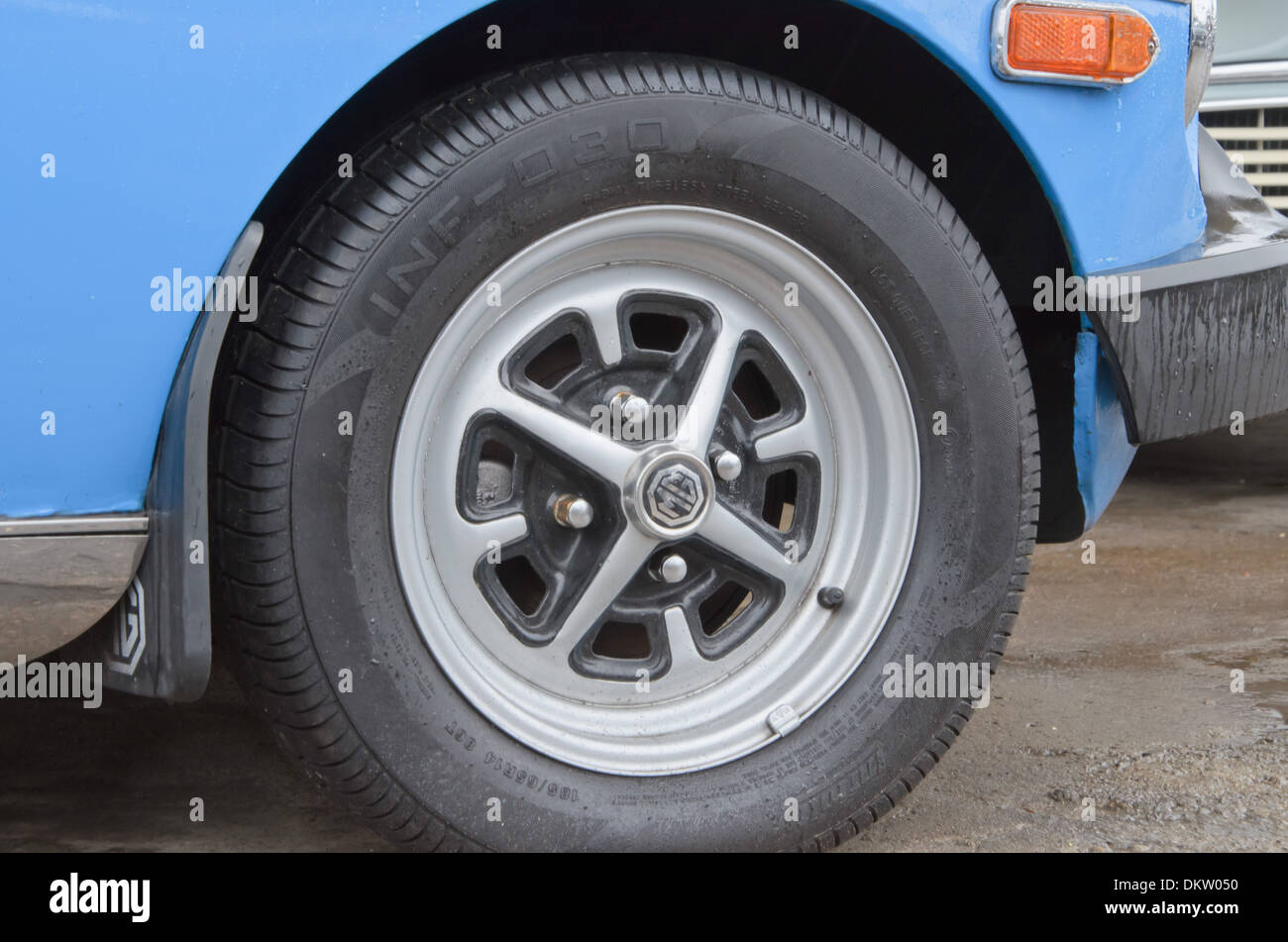 Close up detail of car wheel.  Blue MG midget Stock Photo