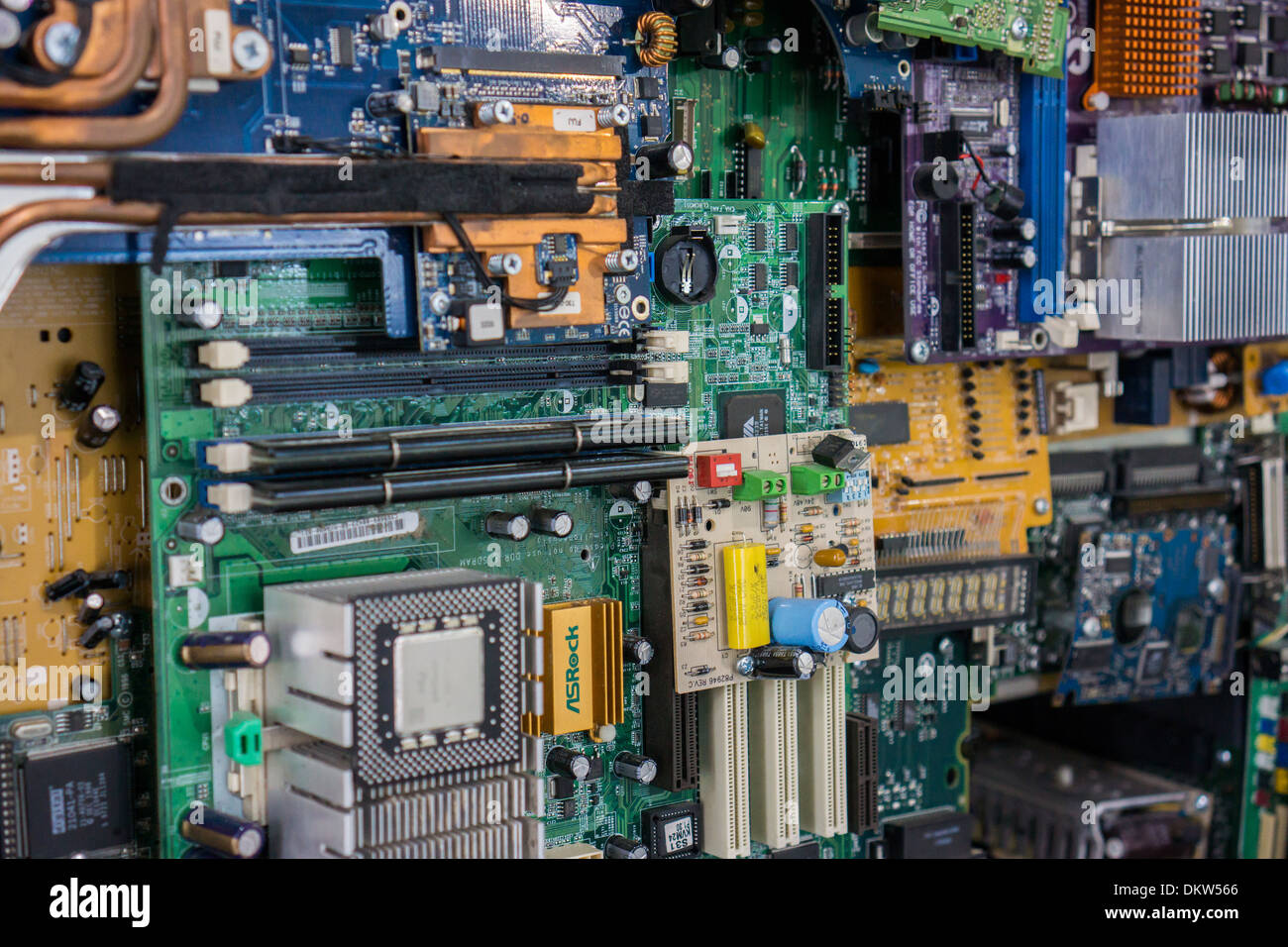 Various circuit boards and other computer parts are collaged in 