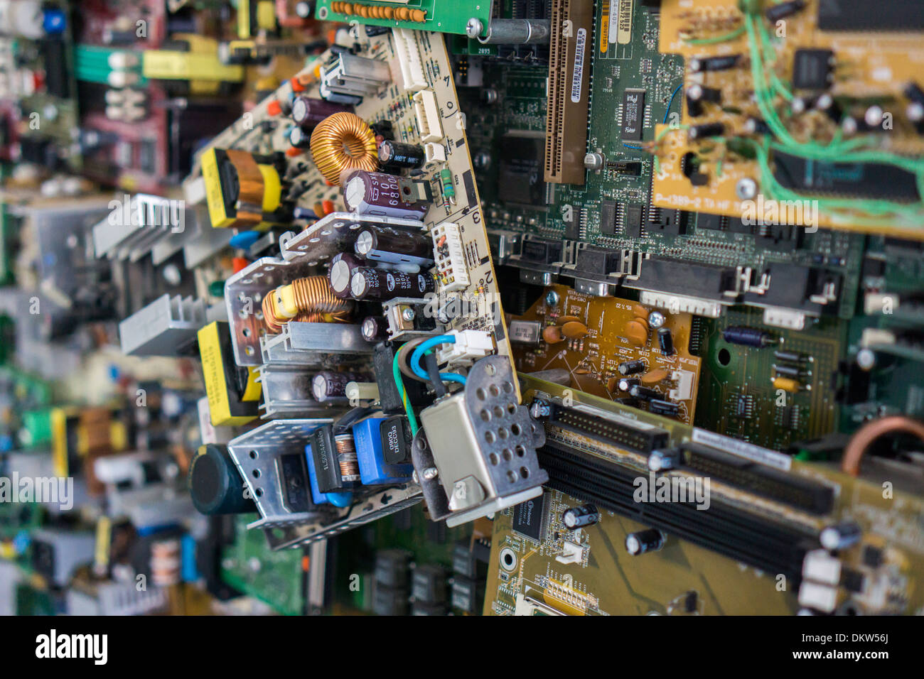Various circuit boards and other computer parts are collaged in 