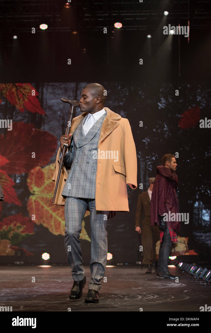 Birmingham, UK. 9th Dec, 2013. Clothes Show Live at the National Exhibition Centre, Birmingham, UK. beebs ka'ye playing to the crowd whilst wearing Beyond Retro - Over Coat Hugh Harris - Shirt Bespoke HQ - Suit New Look - Boots Credit:  Paul Hastie/Alamy Live News Stock Photo