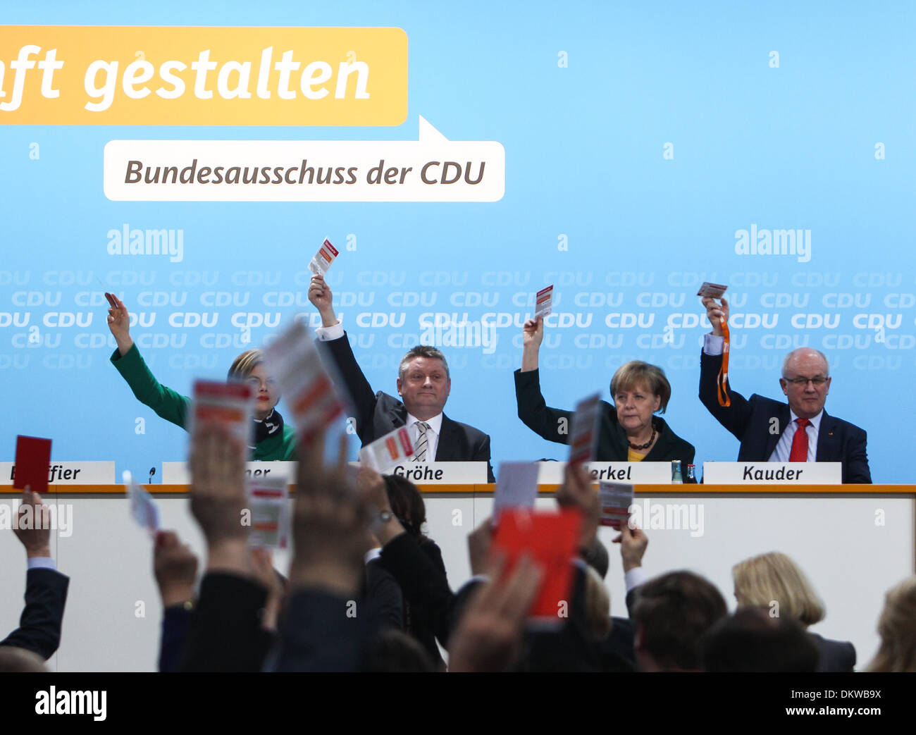 Berlin, Germany. 9th Dec, 2013. German Chancellor Angela Merkel (2nd R) votes for the coalition agreement with the Social Democratic Party (SPD) during a party conference of Germany's Christian Democratic Union (CDU) in Berlin, Germany, on Dec, 9, 2013. Angela Merkel's conservative bloc of CDU voted for the alliance with the center-left Social Democratic Party (SPD) on a small party conference on Monday. © Zhang Fan/Xinhua/Alamy Live News Stock Photo