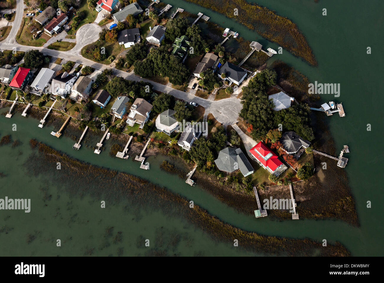 Aerial view of waterfront homes and docks along the marsh in Charleston