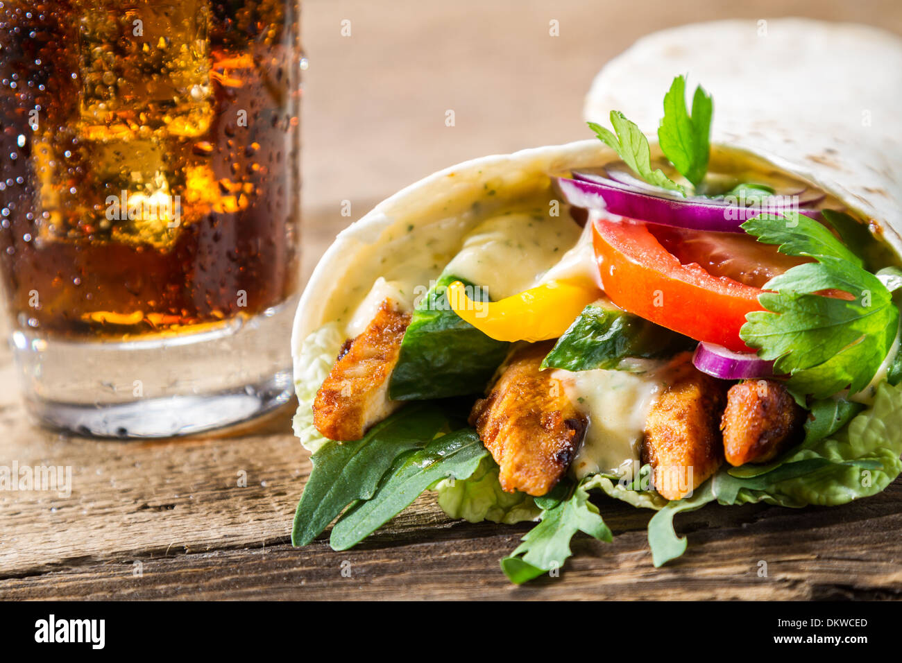 Closeup of kebab with fresh vegetables and chicken on black background Stock Photo