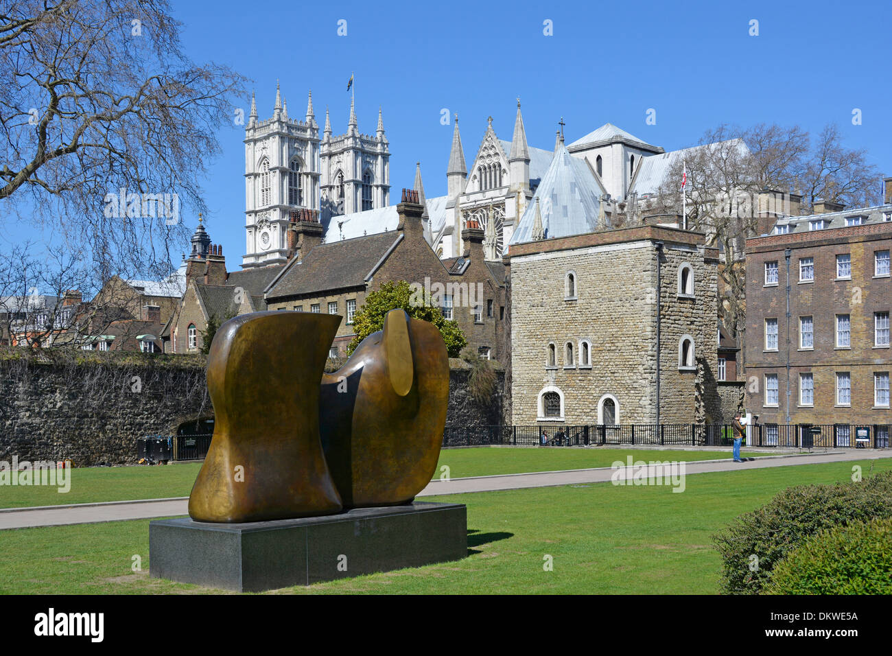 Sculptor Henry Moore bronze abstract modern art sculpture Knife Edge Two Piece in College Green Park Jewel Tower & Westminster Abbey beyond London UK Stock Photo