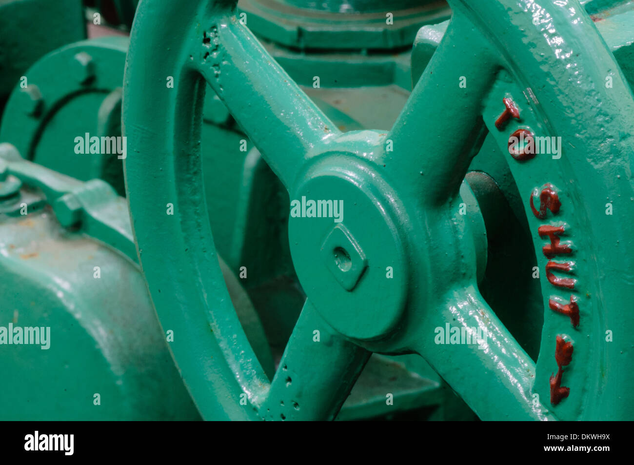 A large castiron cutoff wheel on a valve Stock Photo Alamy