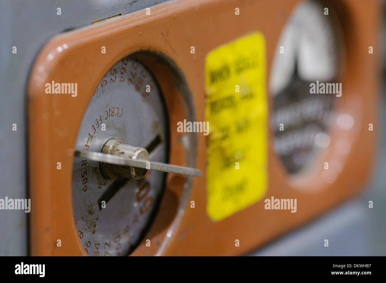 Close-up of the coin slot on an old fashioned gas meter from the 1950s/1960s Stock Photo