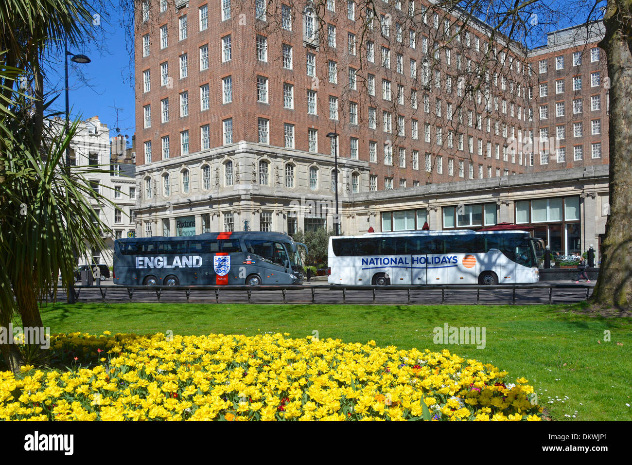 Park Lane and The Grosvenor House Hotel buildings with England football team coach parked