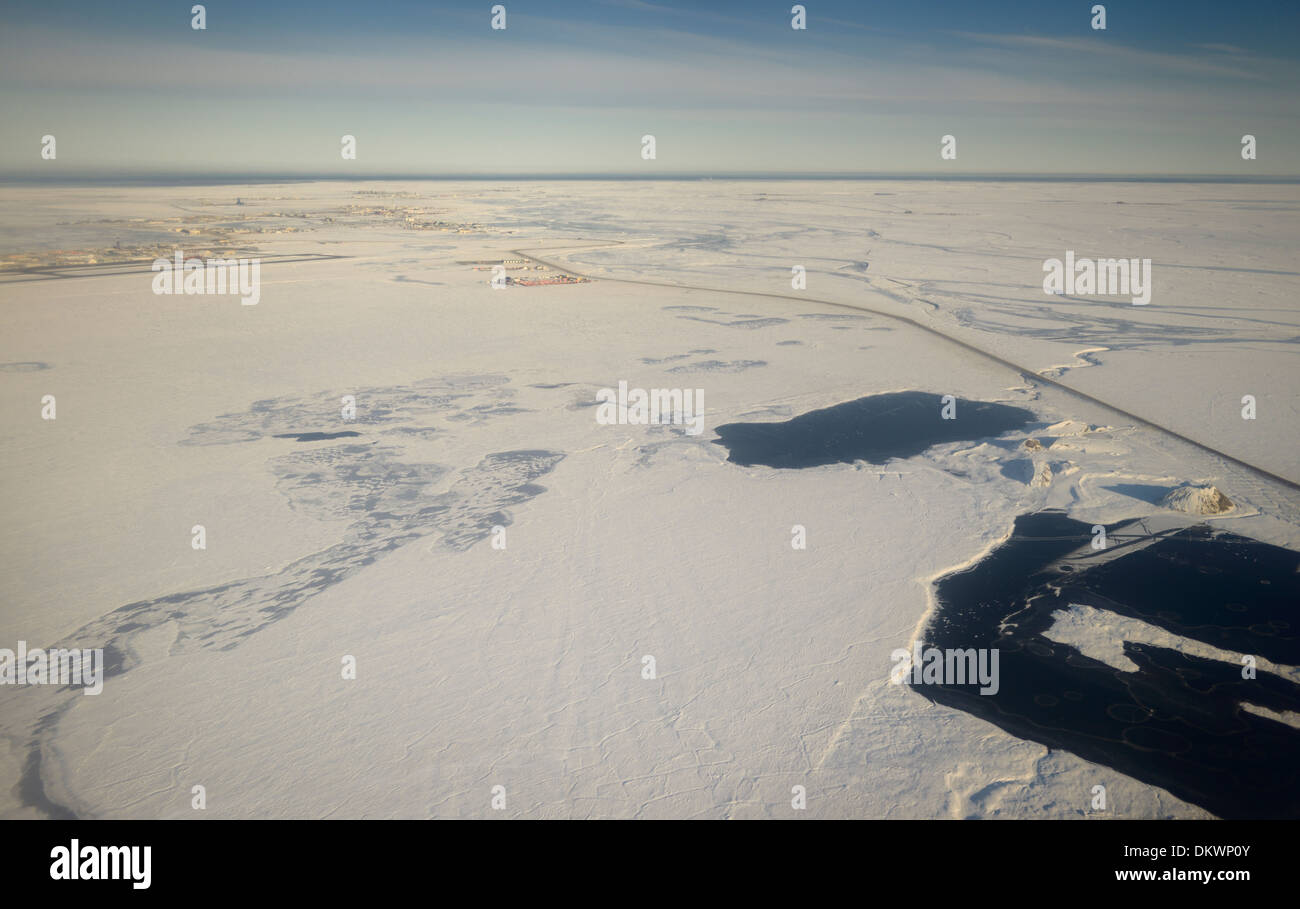 Aerial view of snow covered Deadhorse Alaska USA and the Sag river at Prudhoe Bay Beaufort Sea Arctic Ocean Stock Photo