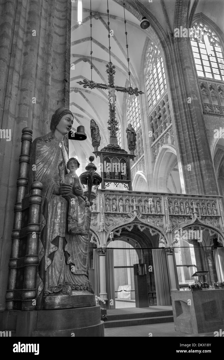 LEUVEN - SEPTEMBER 3: Nave of st. Peters gothic cathedral and gothic statue of Madonna in September 3, 2013 in Leuven, Belgium. Stock Photo
