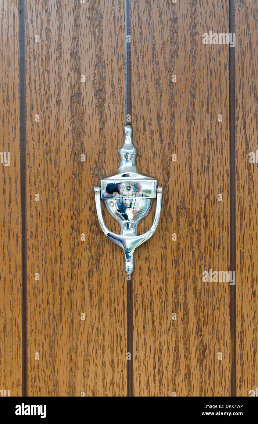 A door knocker on a front door Stock Photo