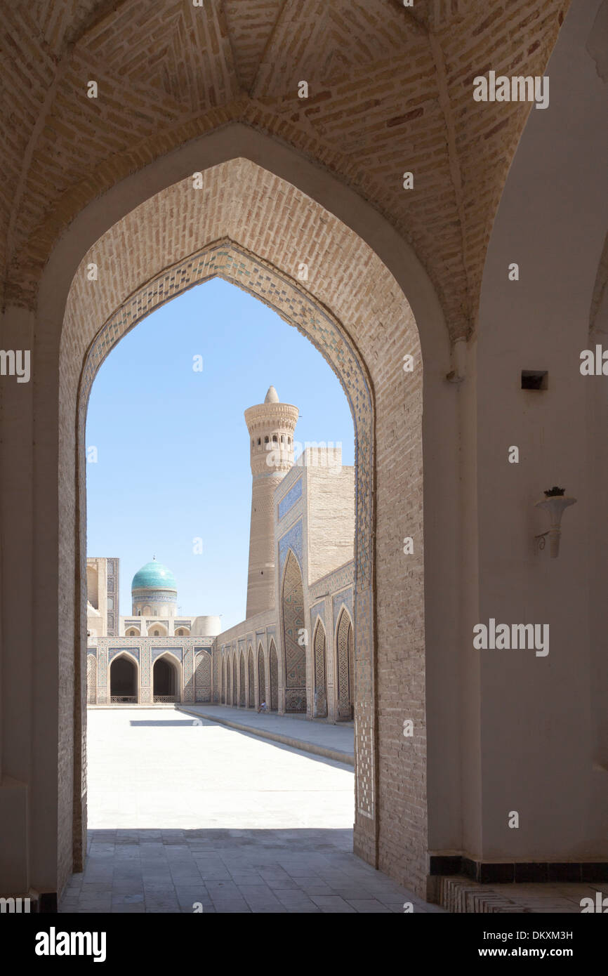 Kalon Mosque courtyard, also known as Kalyan Mosque, Kalon Minaret and Mir-i Arab Madrasah behind, Bukhara, Uzbekistan Stock Photo