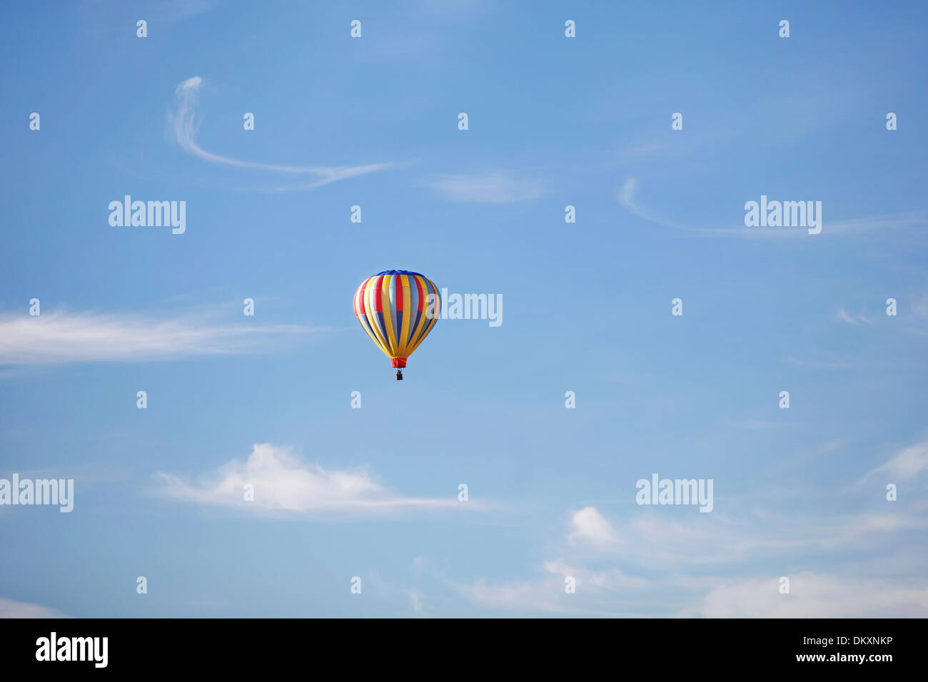 A hot air balloon flying on a beautiful summer day Stock Photo