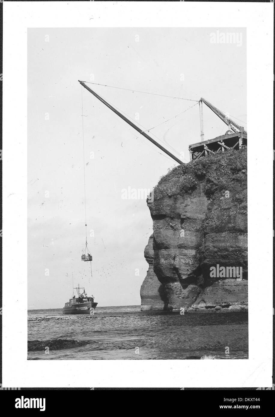 'The lift - only method of going aboard.' Cape Flattery Lightstation, 1943., ca. 1943 - ca. 1953 298190 Stock Photo