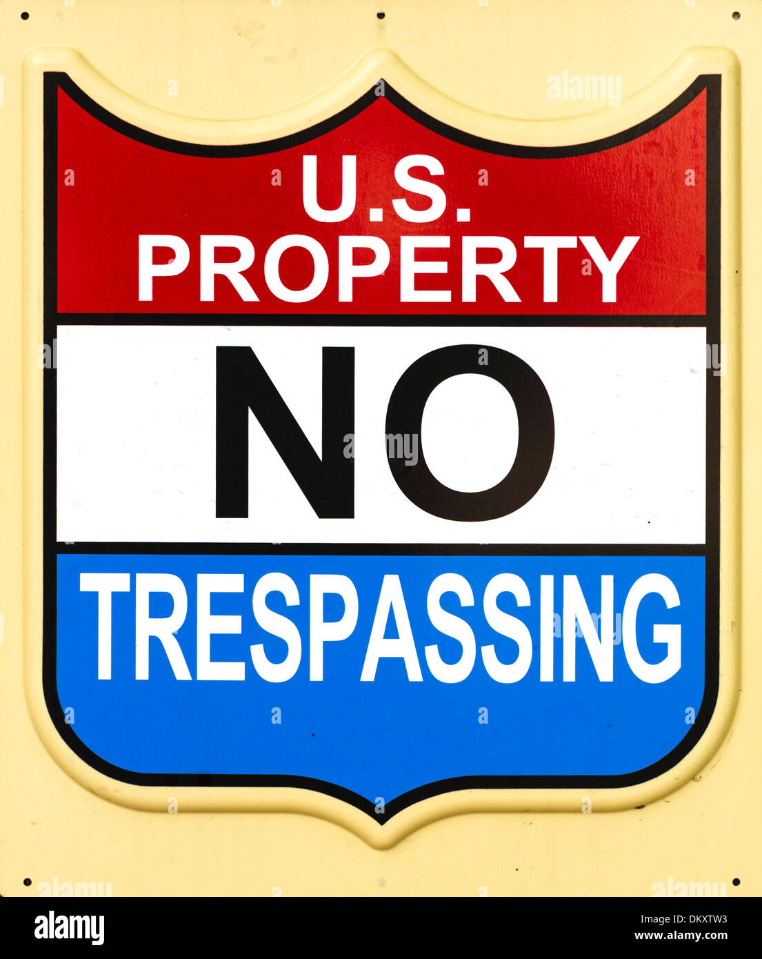 US Property No Trespassing sign on the side of a Federal building in downtown Miami, Florida, USA Stock Photo