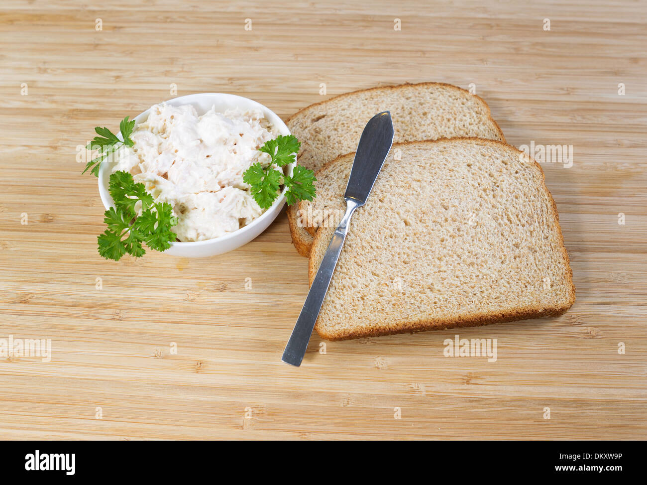 Photo of tuna fish sandwich ingredients and spread knife with natural