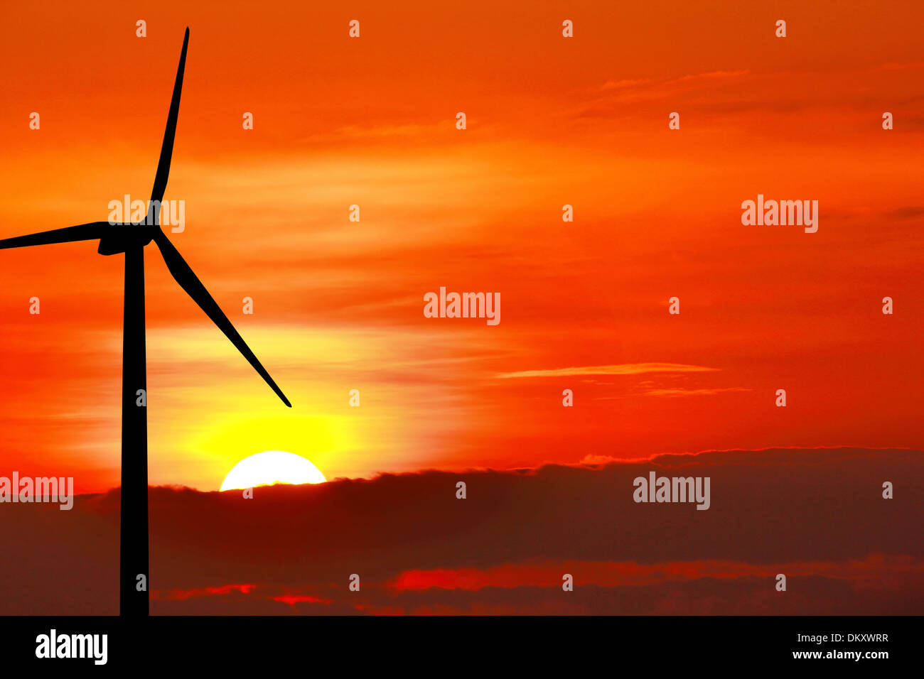 Wind turbine silhouette on sunset background Stock Photo