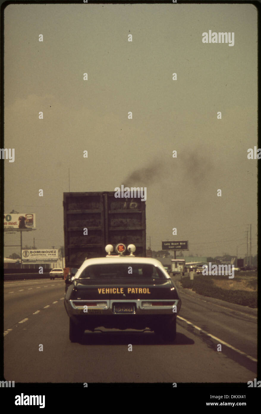 AIR POLLUTION CONTROL DEPARTMENT OFFICERS FOLLOWING TRUCK VIOLATOR (WHO LATER RECEIVED A CITATION) 542755 Stock Photo