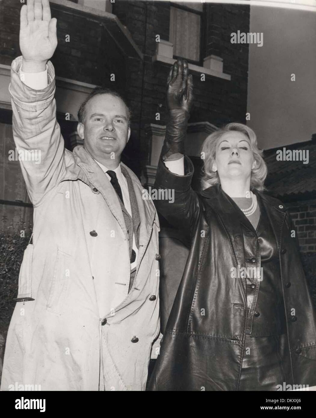 ovn Compulsion Besiddelse Jan 11, 1965 - London, England, United Kingdom - COLIN JORDAN and his wife  give the Nazi salute after he painted him self black and tried to nominate  himself as the candidate