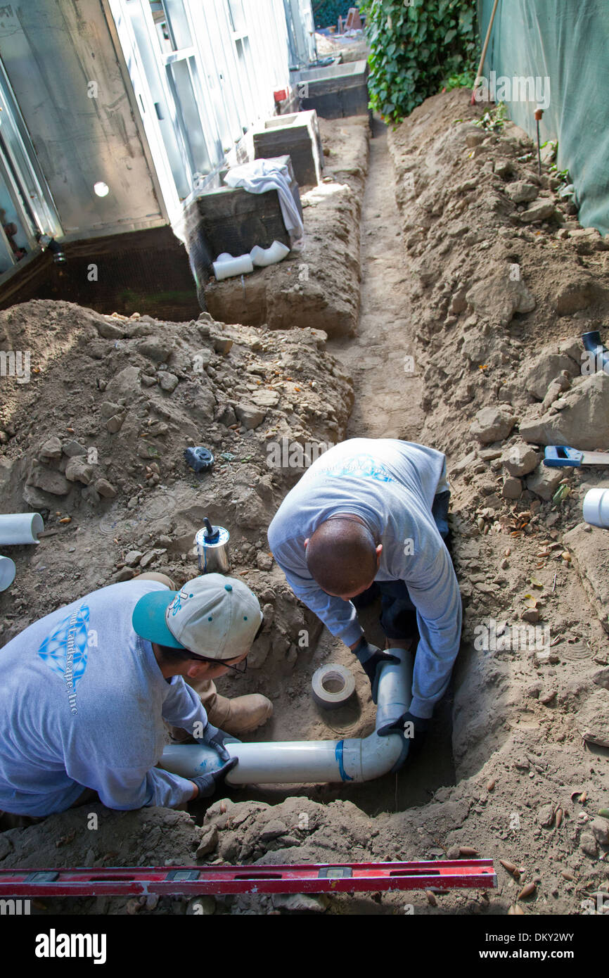 Poly Vinyl Chloride (PVC) Pipes being installed for rainwater harvesting system at new home
