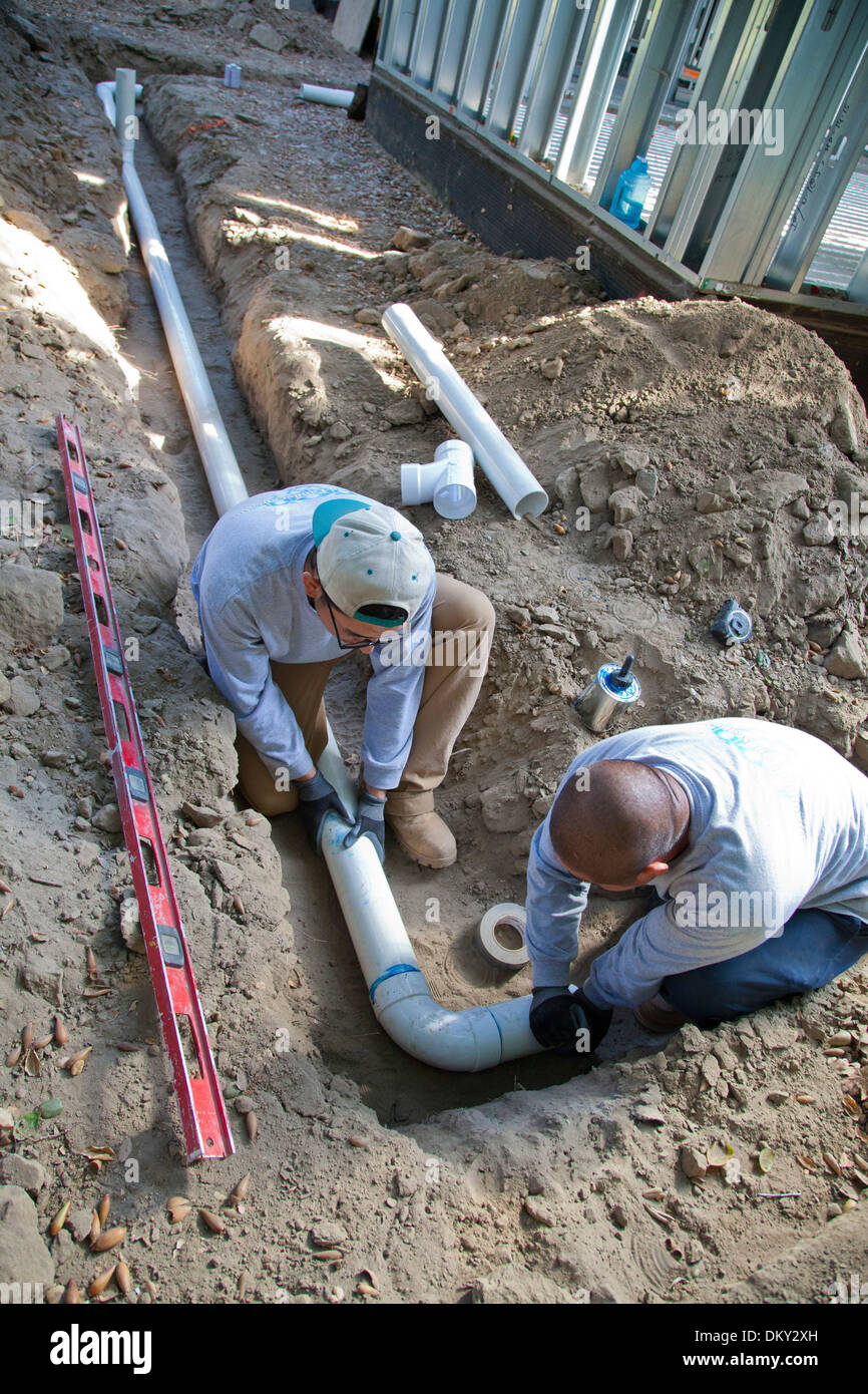 Poly Vinyl Chloride (PVC) Pipes being installed for rainwater