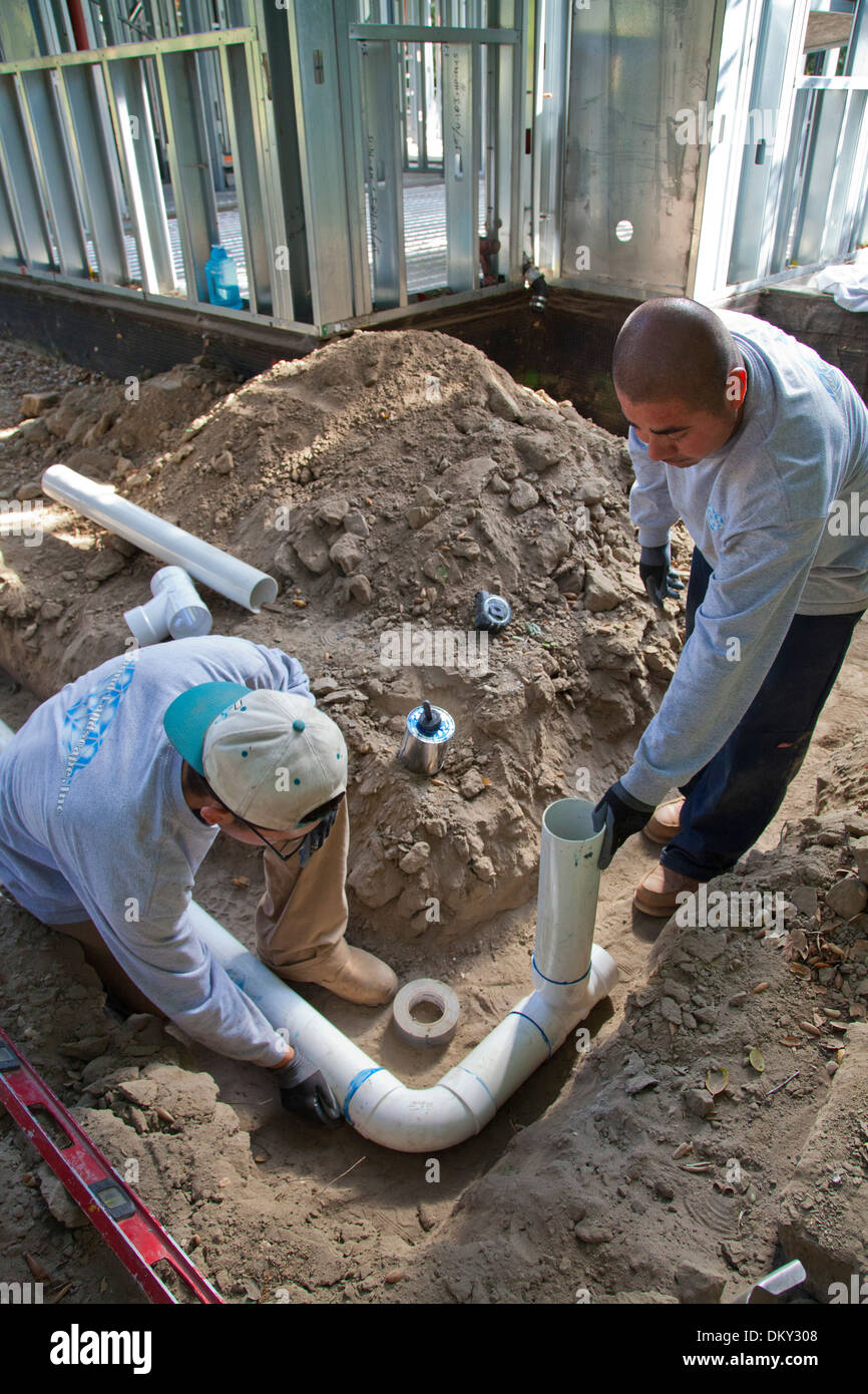 Poly Vinyl Chloride (PVC) Pipes being installed for rainwater