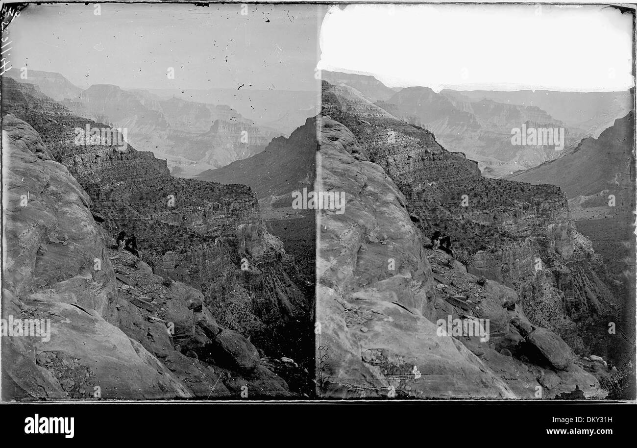 Colorado River. Grand Canyon near Toroweap5E or Muav. A man is shown left center of photo sitting on a canyon ledge... 518028 Stock Photo