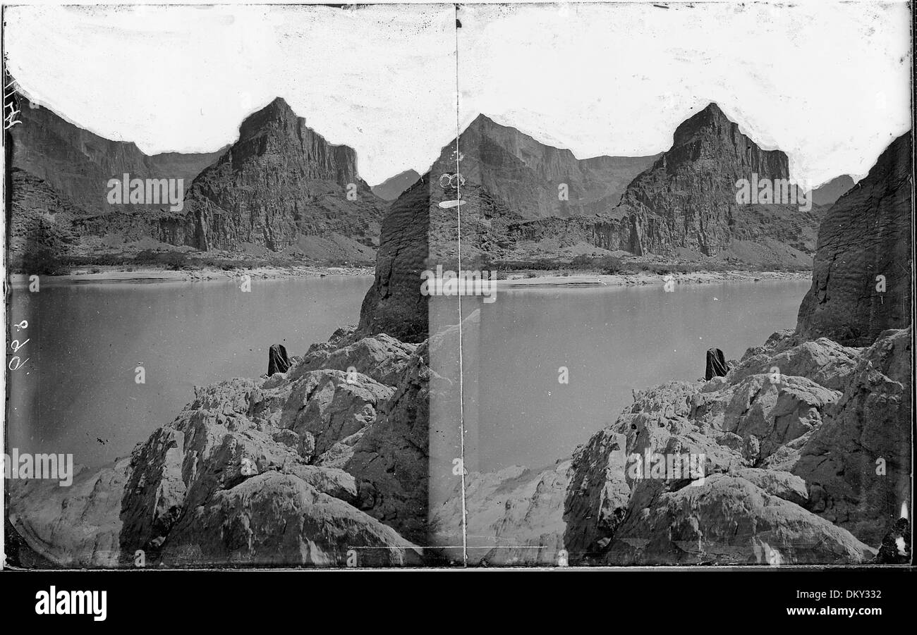 Colorado River. Marble Canyon, tent shown on right bank. Old nos. 518, 899. 518007 Stock Photo