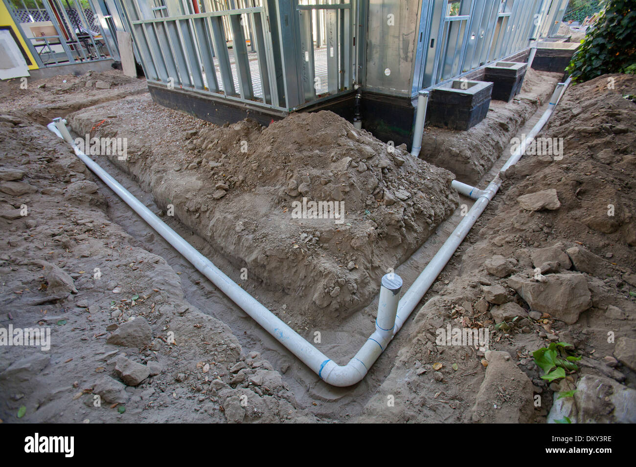 Poly Vinyl Chloride, PVC Pipes being installed for rainwater harvesting system at new home construction. Los Angeles, California Stock Photo