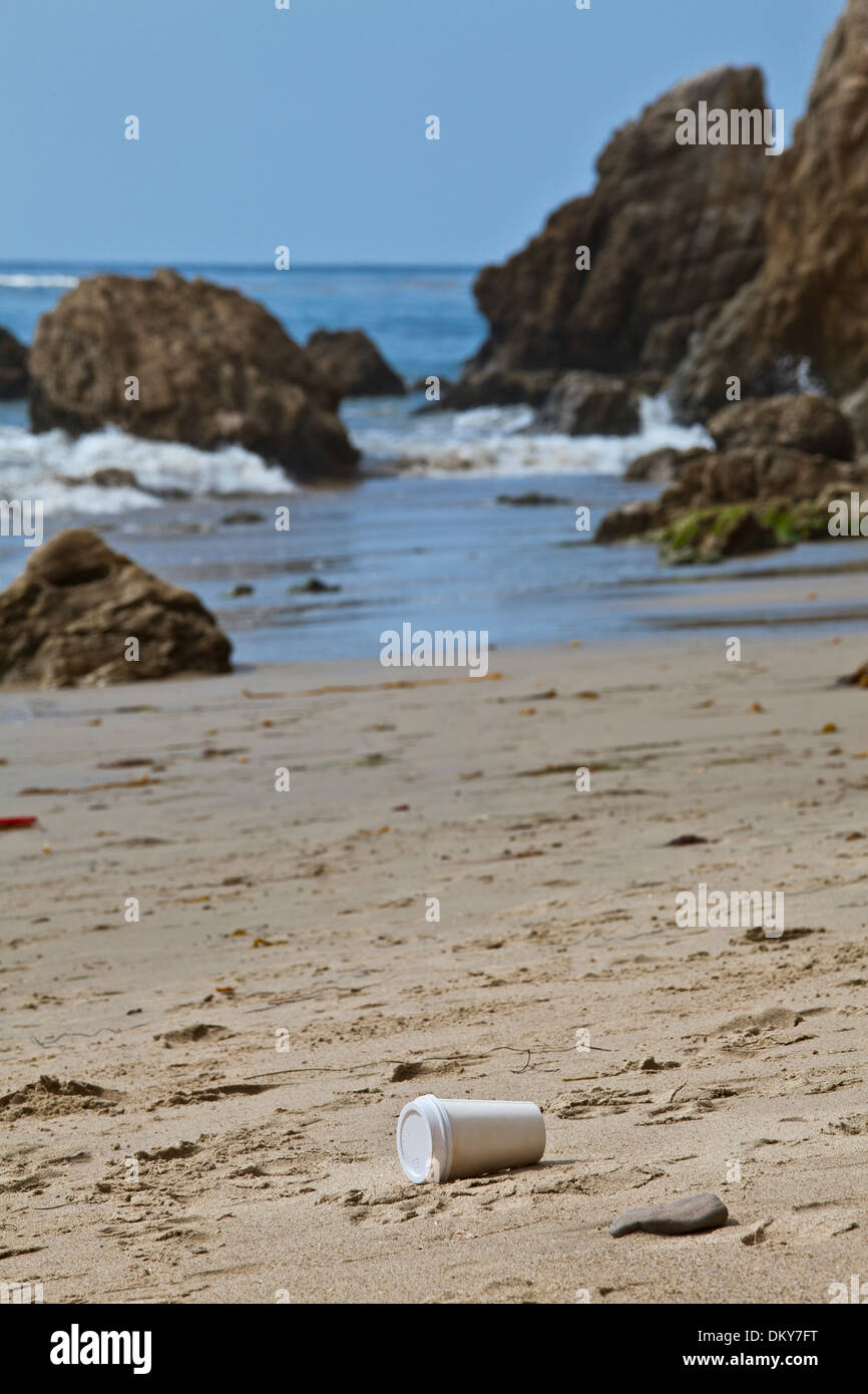 Coffee cup on beach, El Matador State Beach, Malibu, Los Angeles County, California Stock Photo
