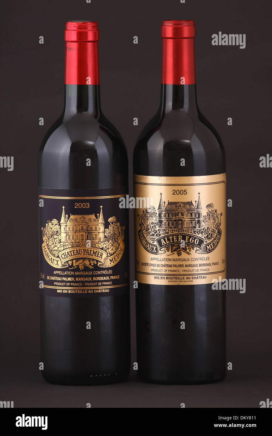 Two bottles of French red wine, first growth Chateau Palmer, Margaux, Bordeaux of year 2003 and second growth Alter Ego 2005 Stock Photo