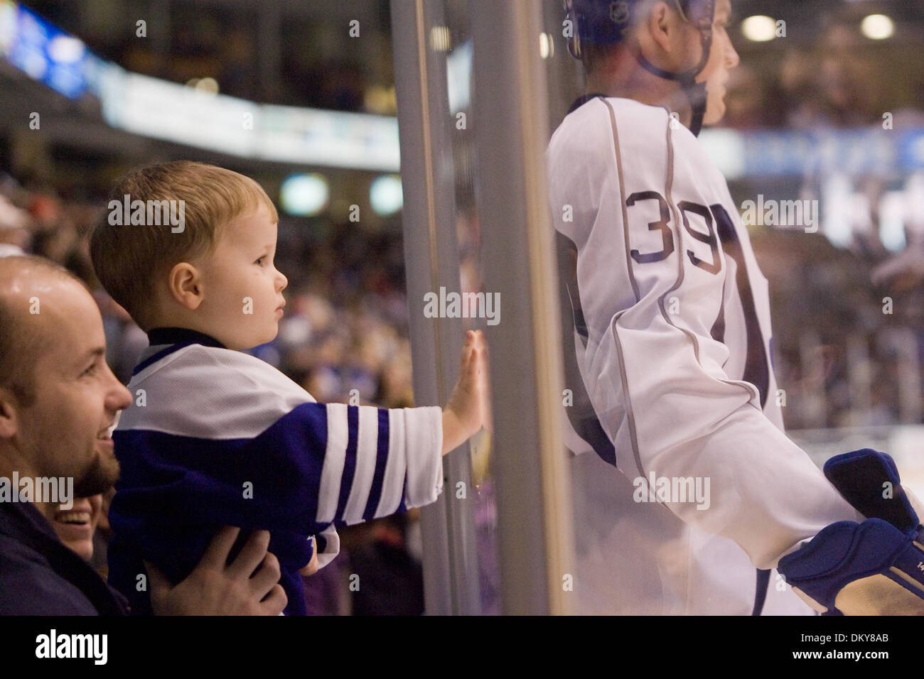 Feb. 28, 2010 - Oshawa, Ontario, Canada - 28 February 2010: a young hockey fan watches members of the Toronto Maple Leafs practice and entertain a sold-out crowd at the GM Centre in Oshawa, Ontario. (Credit Image: © Steve Dormer/Southcreek Global/ZUMAPRESS.com) Stock Photo