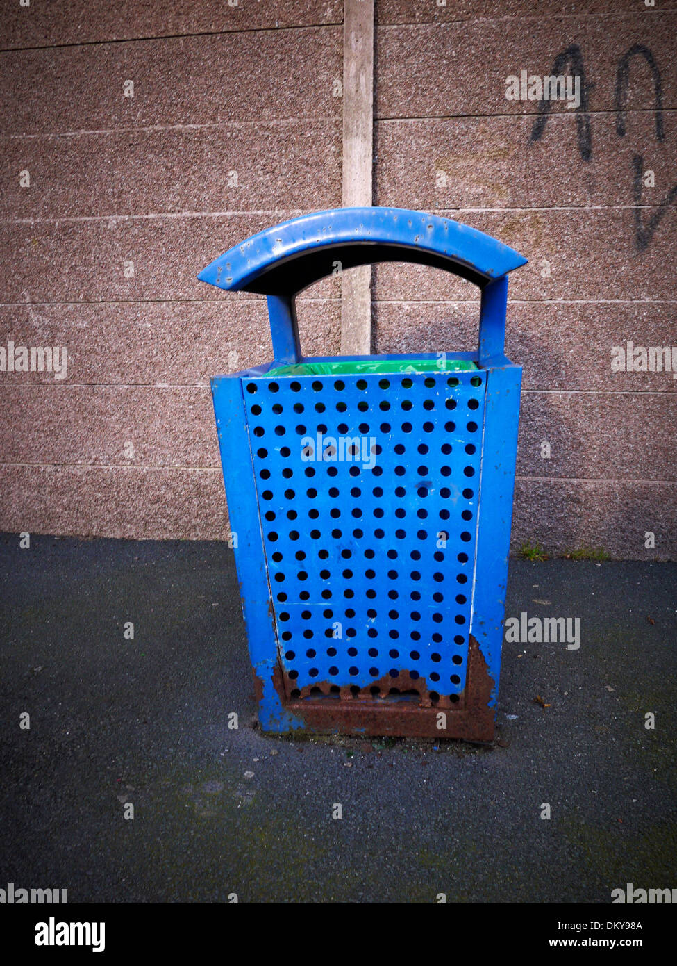 Blue rusty rubbish bin uk Stock Photo