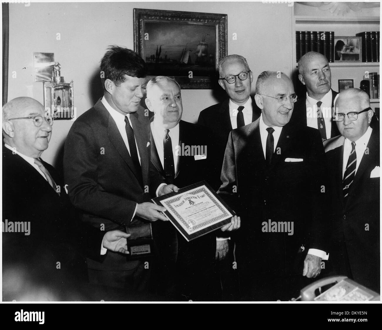 President Kennedy is presented AAU Life Membership Plaque. (L-R) Ed Rosenblum, Chairman AAU Life Membership... 194175 Stock Photo