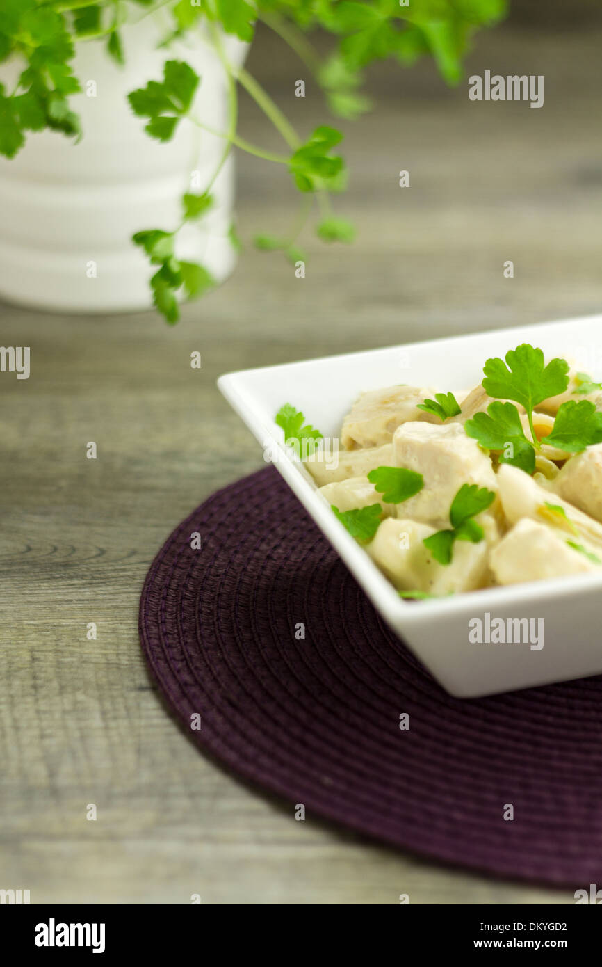 Chicken Alfredo pasta dish garnished with parsley Stock Photo Alamy