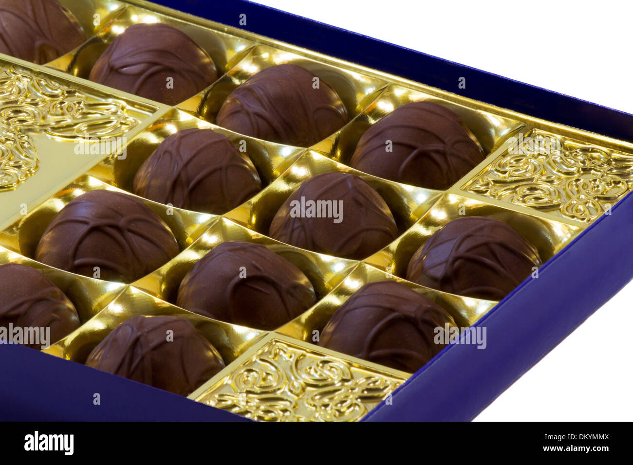 Fragment of the open blue boxes of chocolates. Presented on a white background Stock Photo
