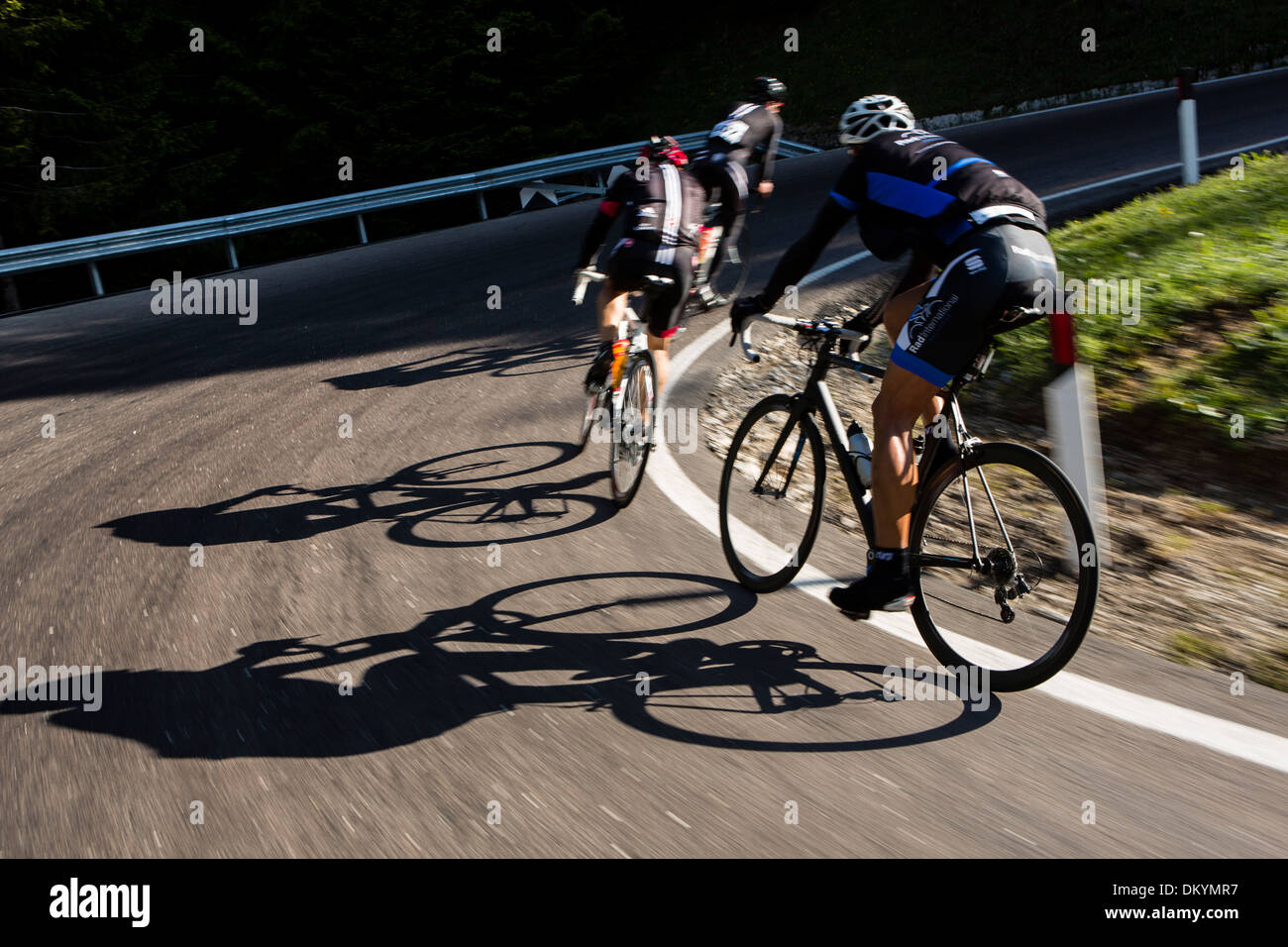 Cyclists round a corner during the Maratona dles Dolomites race in Italy, 2013 Stock Photo