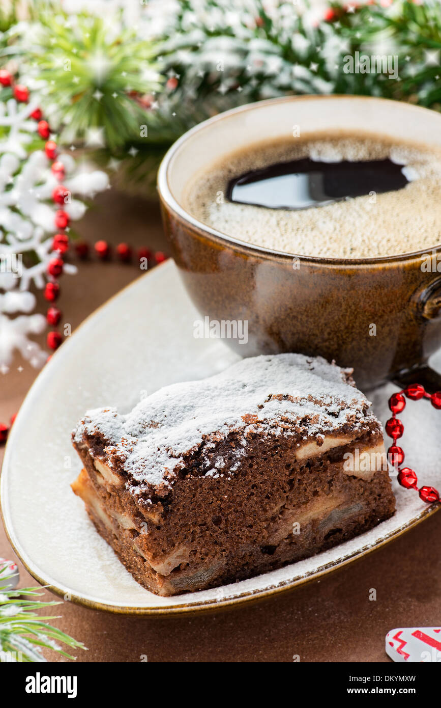 Chocolate pie and cup of coffee with festive decorations, selective focus Stock Photo