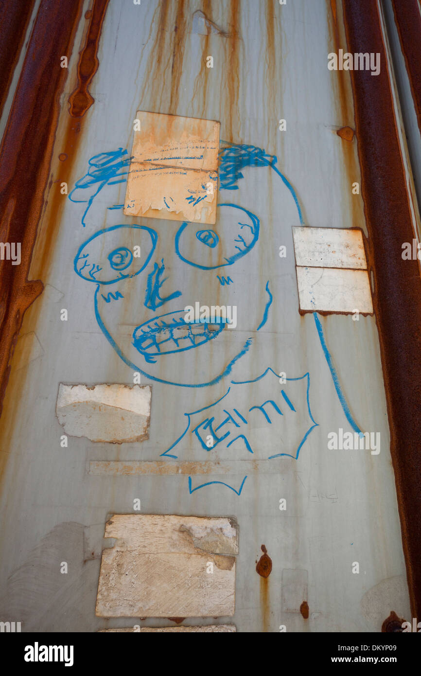 Graffiti of face on alley wall - Seoul, South Korea Stock Photo