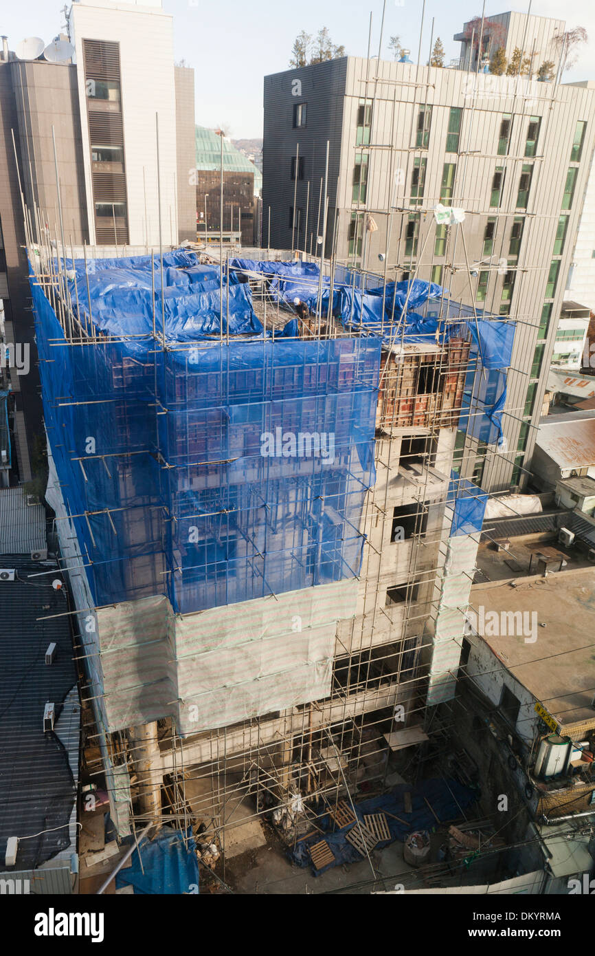 High-rise construction safety netting on building - Seoul, South Korea Stock Photo