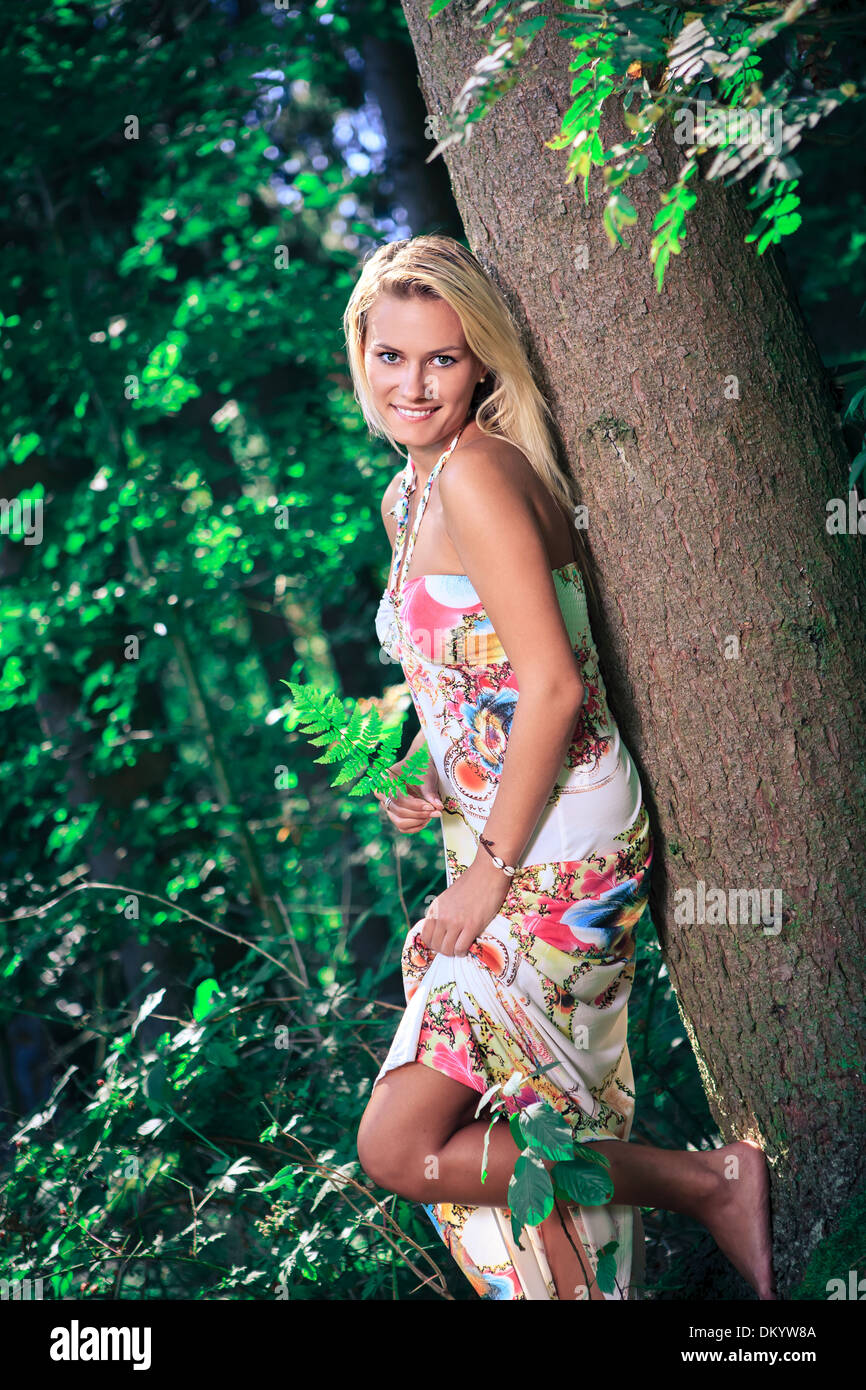 an outdoor portrait of a young woman in the forest Stock Photo - Alamy