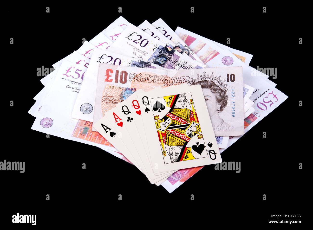 Playing cards and money in casino. Stock Photo