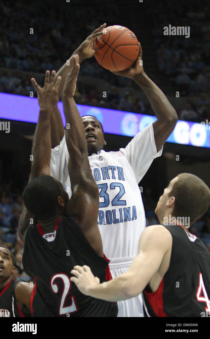 Nov. 23, 2009 - Chapel Hill, North Carolina, U.S - November 23, 2009: UNC forward Ed Davis #32 shoots between defenders Gardner-Webb forward Joshua Henley #2 and Gardner-Webb Luke Engelken foward #44. The Gardner-Webb Bulldogs played the University of North Carolina Tarheels at Kenan Stadium in Chapel Hill, North Carolina. (Credit Image: © Margaret Bowles/Southcreek Global/ZUMApres Stock Photo