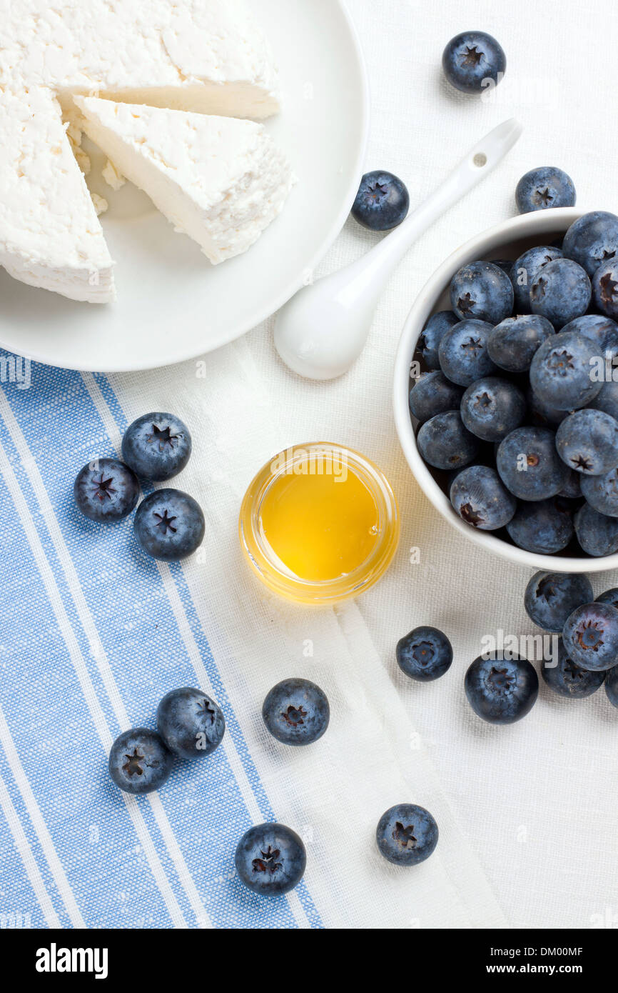 Cottage cheese, berries and honey, shot from above Stock Photo Alamy
