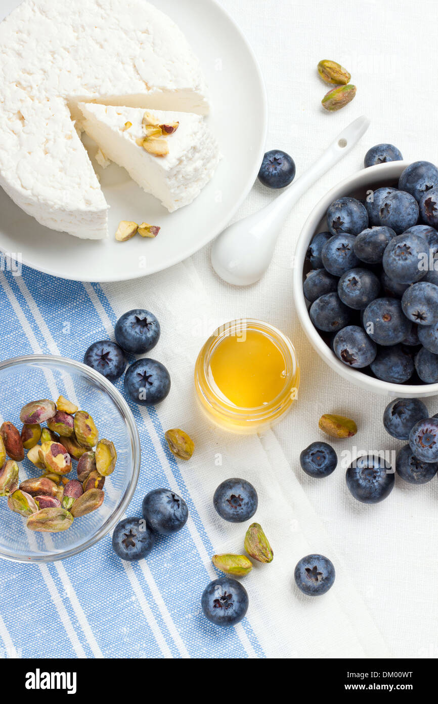 Homemade cottage cheese with berries and nuts, shot from above Stock