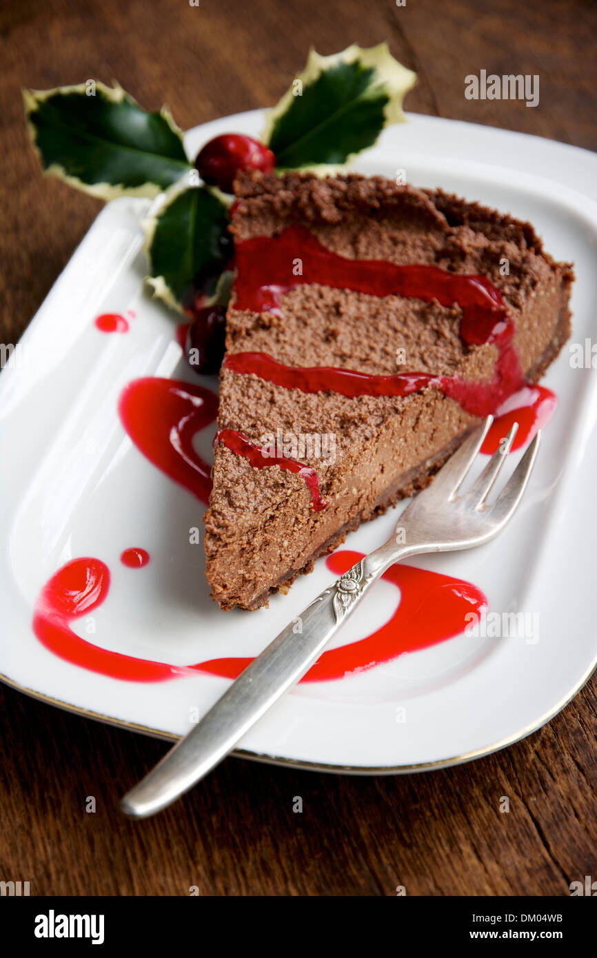Chocolate Cheesecake with Cranberry Coulis Stock Photo