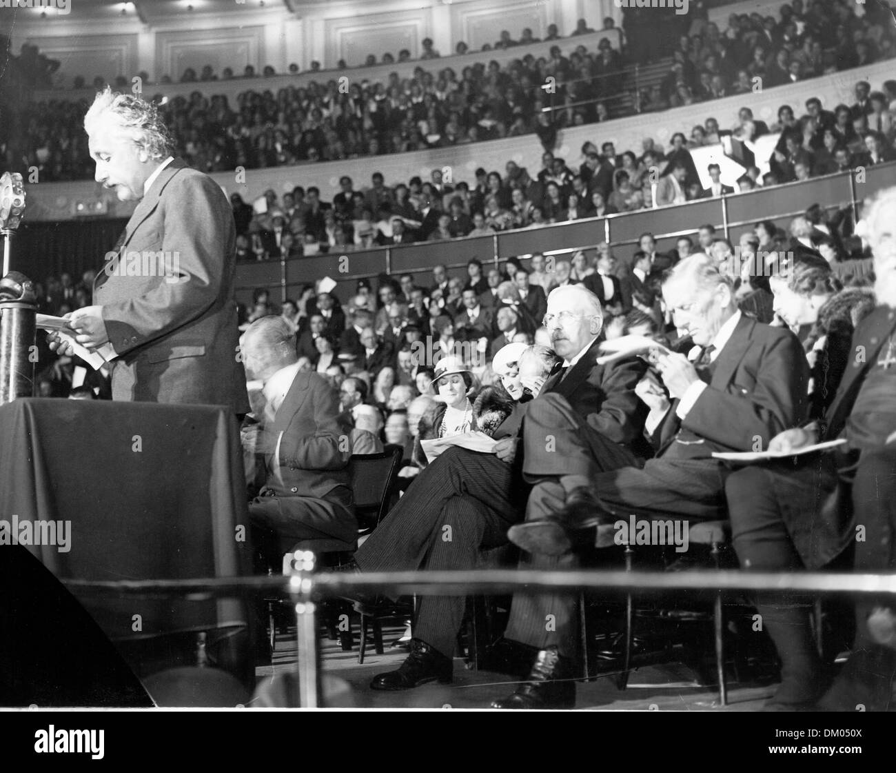 June 17, 1933 - London, England, U.K. - Professor ALBERT EINSTEIN during his 'Science and Civilisation' lecture at the Royal Albert hall with LORD RUTHERFORD, and SIR AUSTEN CHAMBERLAIN seated behind him. Einstein (March 14, 1879 Ð April 18, 1955) was a German theoretical physicist regarded as the greatest scientist of the 20th century. He proposed the theory of relativity and made Stock Photo