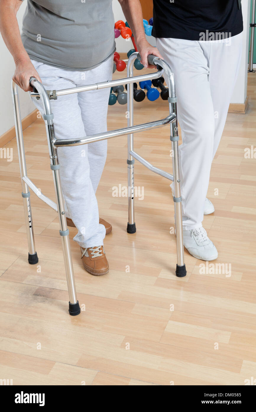 Woman With Walker And Trainer Stock Photo Alamy