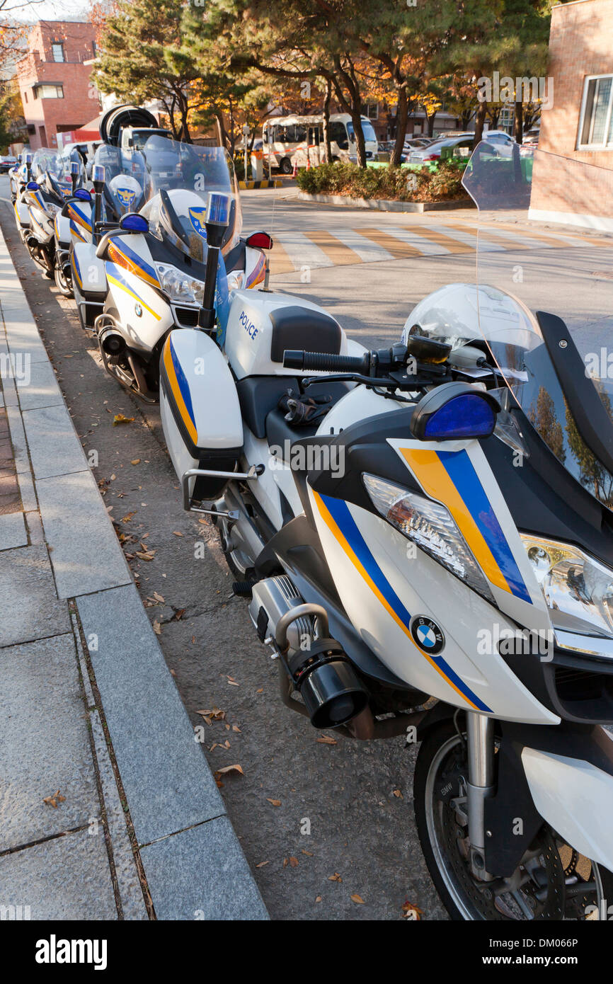 Police motorcycles parked on side of road Seoul, South Korea Stock