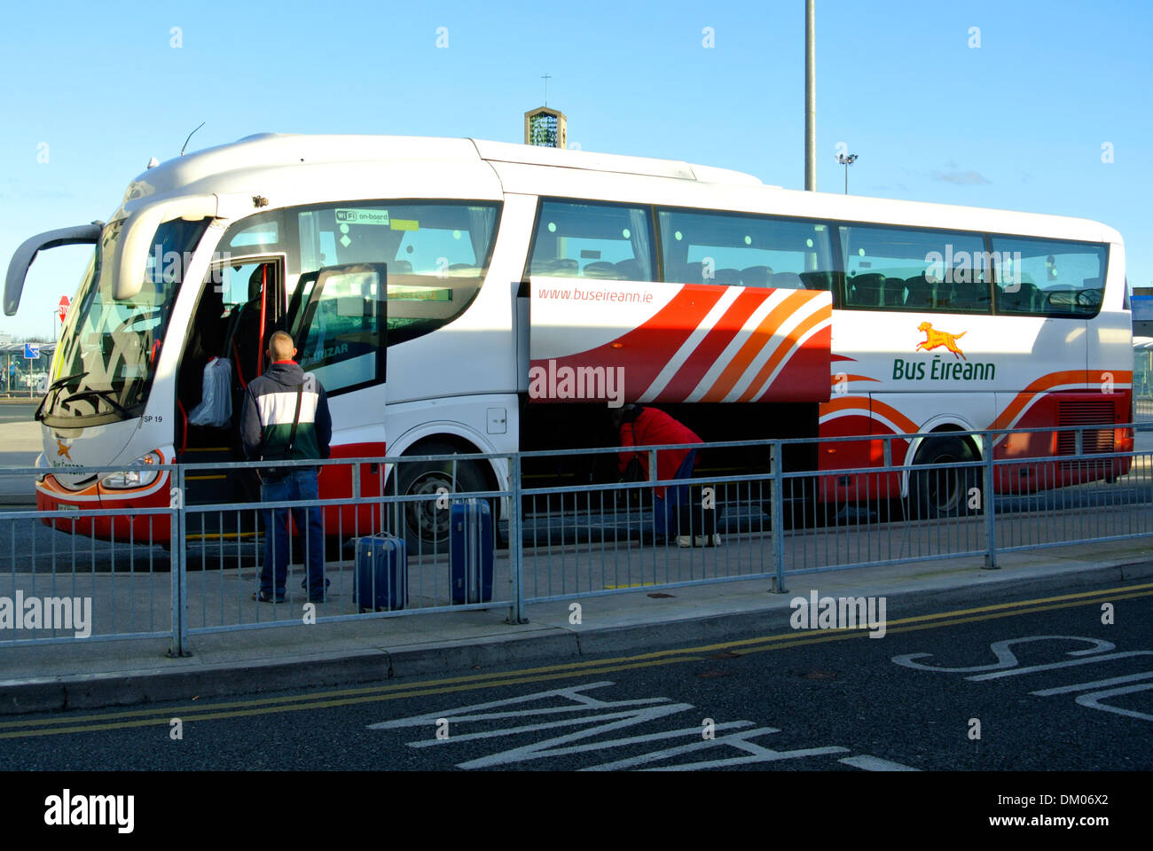 Bus Eireann bus stop at Dublin Airport Ireland waiting passengers Stock